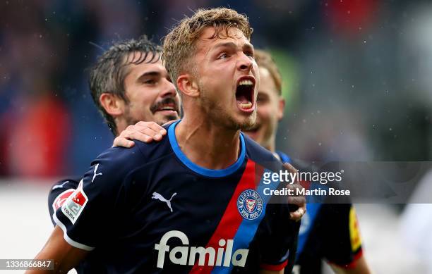 Fiete Arp of Holstein Kiel celebrate with his team mates after he scores his team's 2nd goal during the Second Bundesliga match between Holstein Kiel...