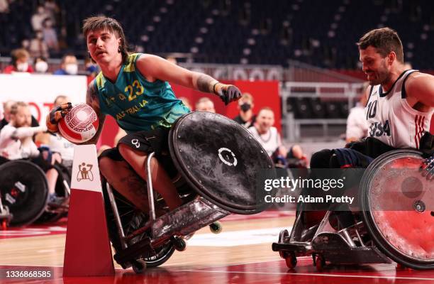 Jayden Warn of Team Australia is challenged by Joshua Wheeler of Team United States during the Wheelchair Rugby semi final between Team United States...