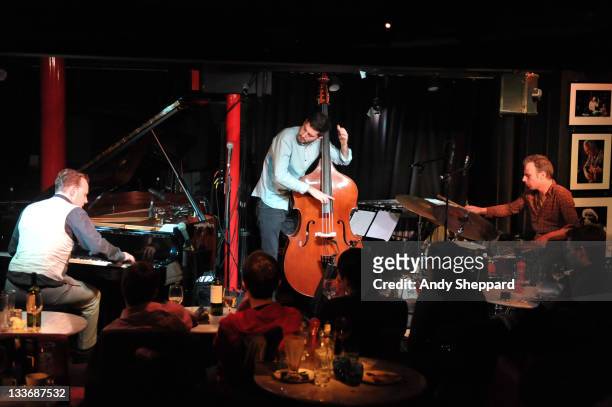Jef Neve, Reuben Samama and Teun Verbruggen of Jef Neve Trio perform on stage at Pizza Express Jazz Club during Day 9 of the London Jazz Festival...