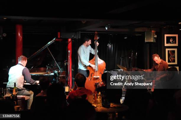 Jef Neve, Reuben Samama and Teun Verbruggen of Jef Neve Trio perform on stage at Pizza Express Jazz Club during Day 9 of the London Jazz Festival...