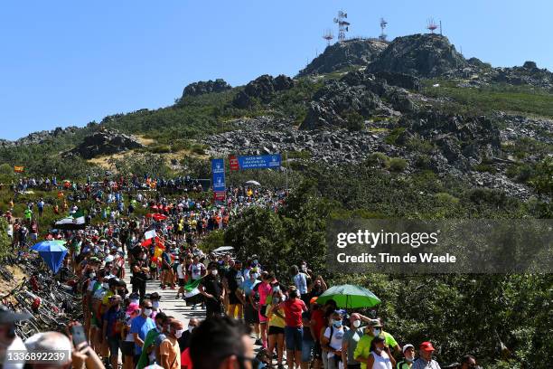 General view of the peloton beginning to climb the Alto Collado de Ballesteros while fans cheer during the 76th Tour of Spain 2021, Stage 14 a...
