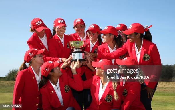 Team USA celebrate with the Curtis Cup trophy after their win over Team Great Britain and Ireland during day three of The Curtis Cup at Conwy Golf...