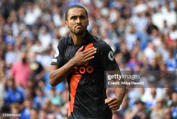 Dominic Calvert-Lewin of Everton celebrates after scoring their sides second goal during the Premier League match between Brighton & Hove Albion and...