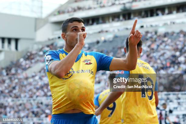 Mohamed Elyounoussi of Southampton celebrates after scoring their sides first goal during the Premier League match between Newcastle United and...