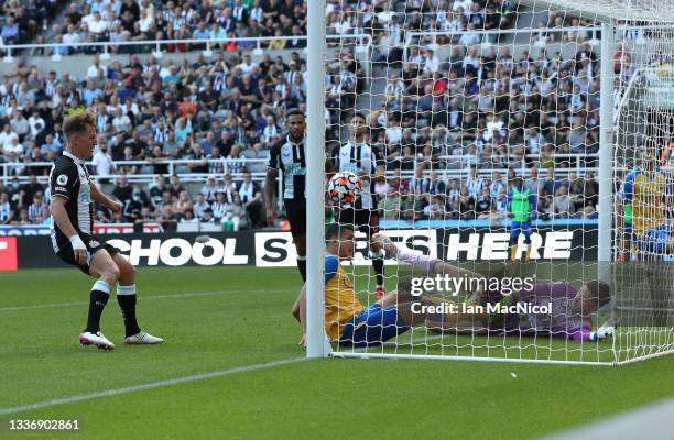 Mohamed Elyounoussi of Southampton scores their sides first goal past Martin Dubravka of Newcastle United during the Premier League match between...