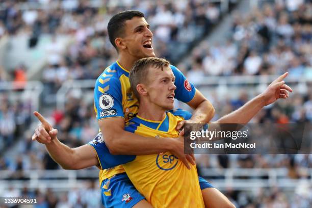 James Ward-Prowse of Southampton celebrates after scoring their sides second goal with team mate Mohamed Elyounoussi during the Premier League match...