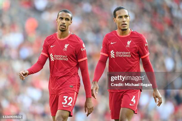 Joel Matip and Virgil van Dijk of Liverpool look on during the Premier League match between Liverpool and Chelsea at Anfield on August 28, 2021 in...