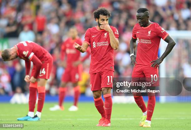 Mohamed Salah and Sadio Mane of Liverpool interact during the Premier League match between Liverpool and Chelsea at Anfield on August 28, 2021 in...