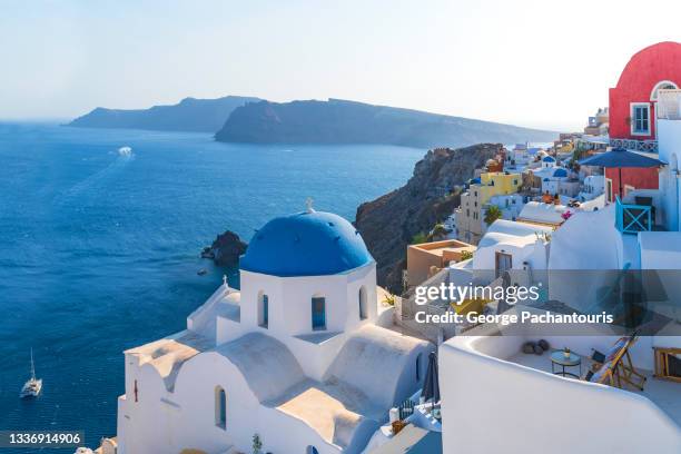 the iconic white church in oia village in santorini, greece - santorini volcano stock pictures, royalty-free photos & images
