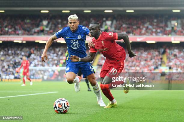 Sadio Mane of Liverpool battles for possession with Thiago Silva of Chelsea during the Premier League match between Liverpool and Chelsea at Anfield...