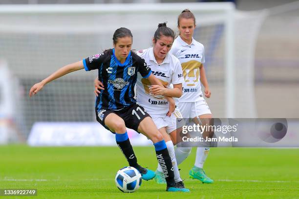 Maritza Dardane Maldonado of Queretaro fights for the ball with Daniela Itzaxaya Garcia of Pumas during a match between Pumas and Queretaro as part...