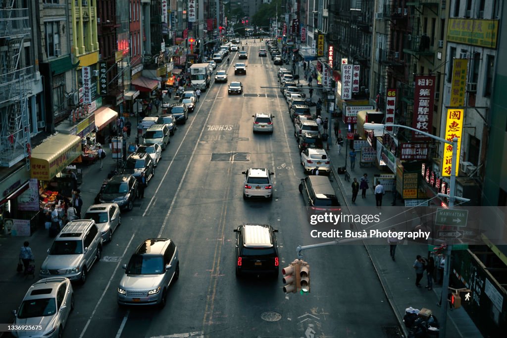 View from above of road in Chinatown at twilight. Manhattan, New York City, USA