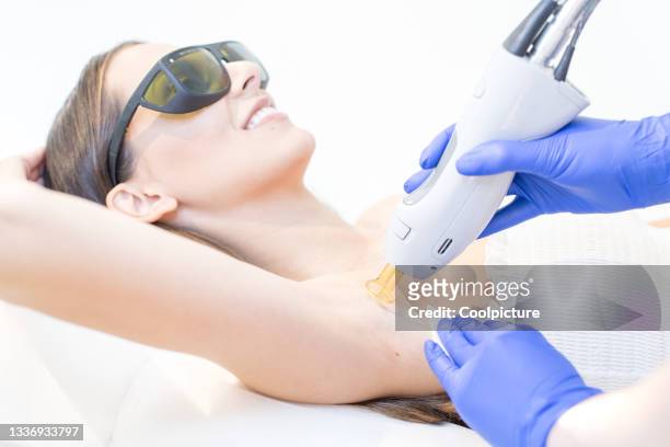 beauty clinic: laser therapy - armpit hair woman stock pictures, royalty-free photos & images