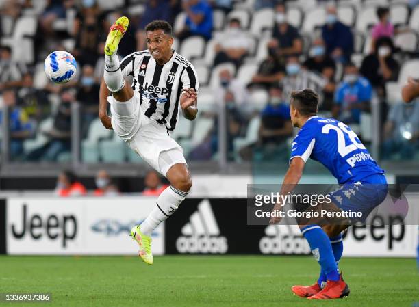 Danilo of Juventus is challenged by Samuele Ricci of Empoli FC during the Serie A match between Juventus and Empoli FC at Juventus Stadium on August...