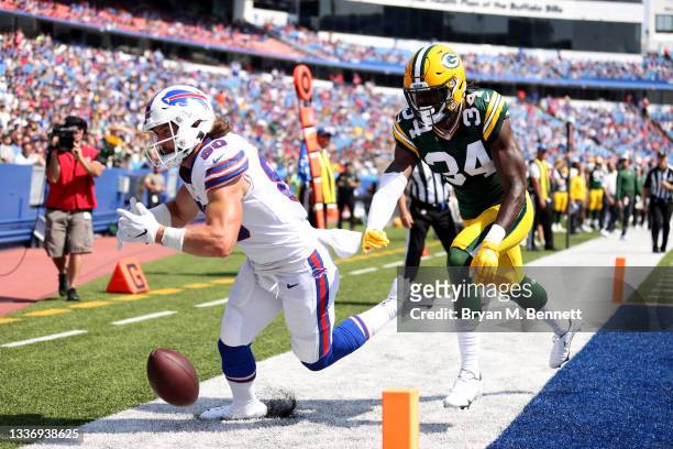 Jacob Hollister of the Buffalo Bills drops a pass as Stephen Denmark of the Green Bay Packers defends him during the third quarter at Highmark...