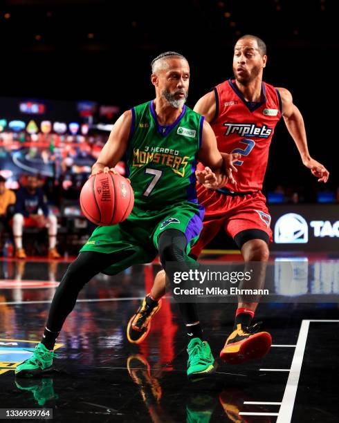 Mahmoud Abdul-Rauf of the 3 Headed Monsters dribbles the ball while being guarded by Jannero Pargo of the Triplets during the BIG3 - Playoffs at...