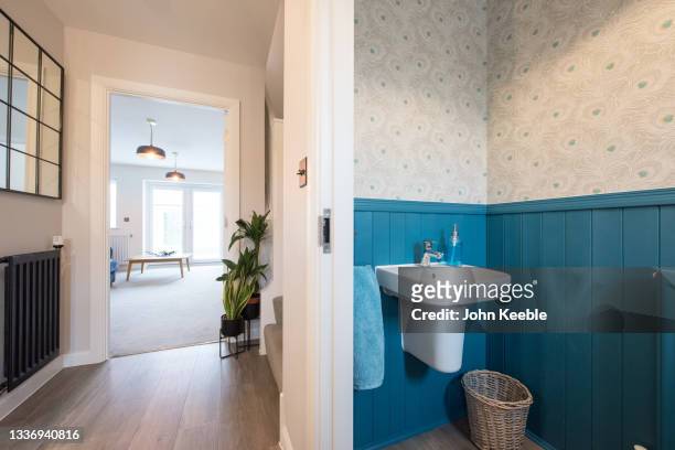 home property interiors - blue bathroom stock pictures, royalty-free photos & images