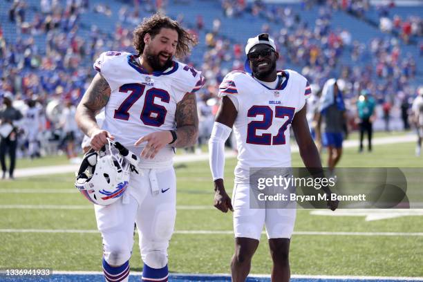 Jon Feliciano and Tre'Davious White, both of the Buffalo Bills, react after defeating the Green Bay Packers 19-0 at Highmark Stadium on August 28,...