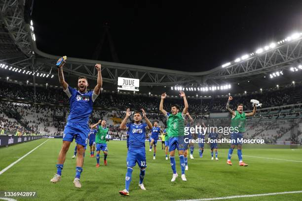 Patrick Cutrone and Nedim Bajrami of Empoli FC lead the celebrations for the 1-0 victory following the final whistle of the Serie A match between...