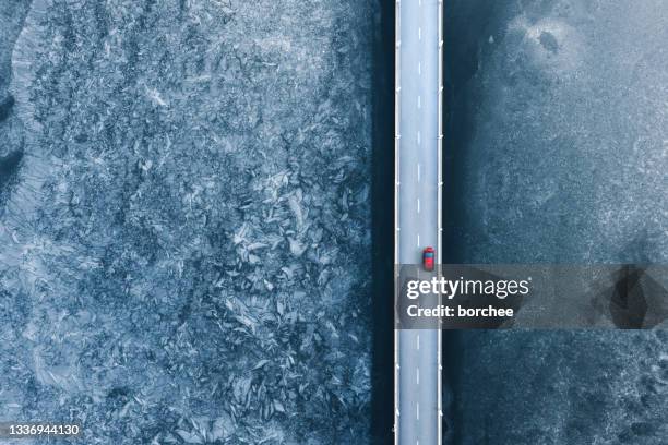 bridge over the frozen lake - footpath aerial stock pictures, royalty-free photos & images