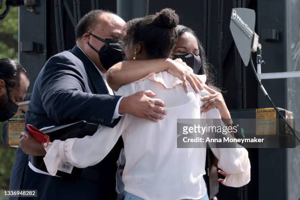 Yolanda Renee King, the granddaughter of Rev. Martin Luther King Jr., hugs her parents Martin Luther King III and Andrea Waters King after giving...