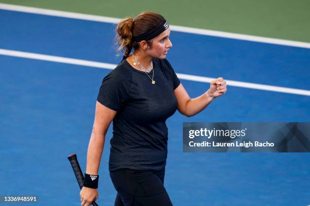 Sania Mirza of India celebrates during the first set of her finals doubles match against Ena Shibahara of Japan and Shuko Aoyama of Japan on day 7 of...