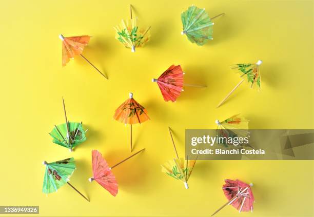 colorful cocktail umbrellas - cocktail umbrella stock-fotos und bilder