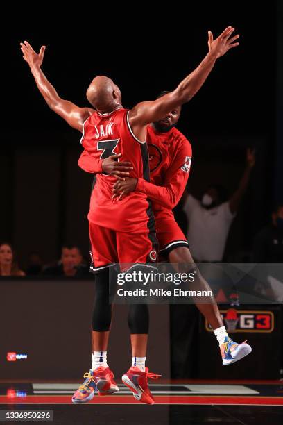 Jarrett Jack and Devin Sweetney of the Trilogy celebrate after Jake made a shot to beat the Tri-State 50-42 during the BIG3 - Playoffs at Atlantis...