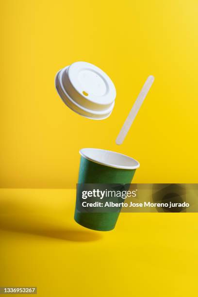 still life take away coffee cup on colorful paper background - paper cup fotografías e imágenes de stock