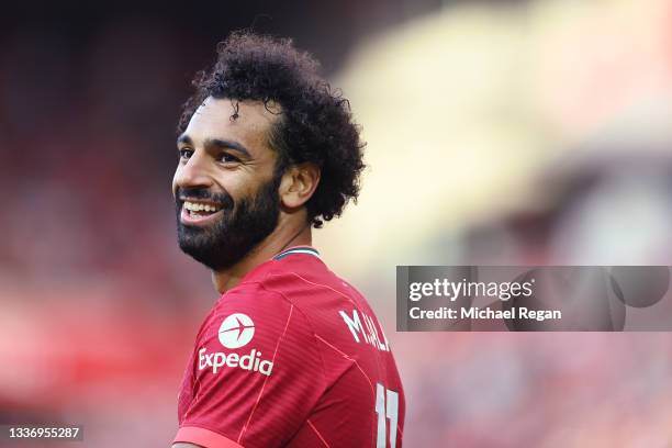 Mohamed Salah of Liverpool smiles during the Premier League match between Liverpool and Chelsea at Anfield on August 28, 2021 in Liverpool, England.