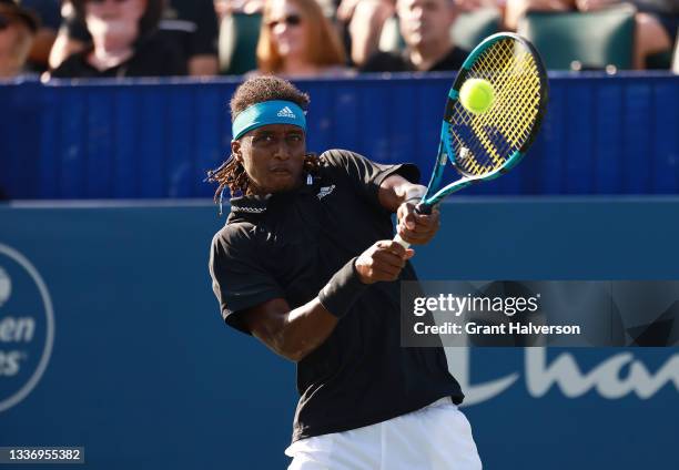 Mikael Ymer of Sweden returns a shot to Ilya Ivashka of Belarus during the finals of the Winston-Salem Open at Wake Forest Tennis Complex on August...