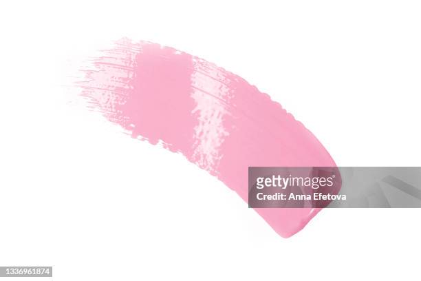 smooth cosmetic smear of pastel pink paint isolated on white background. concept of home repair and herbal cosmetic. flat lay style - brushstroke stock-fotos und bilder