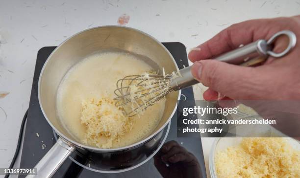 preparation perfectly melting cheese slice - stirring stock pictures, royalty-free photos & images