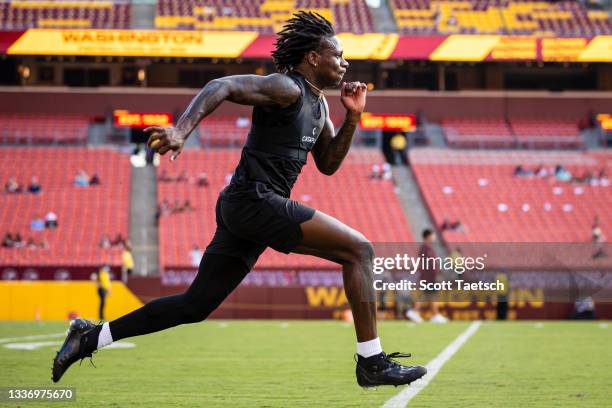 Marquise Brown of the Baltimore Ravens warms up before the preseason game against the Washington Football Team at FedExField on August 28, 2021 in...