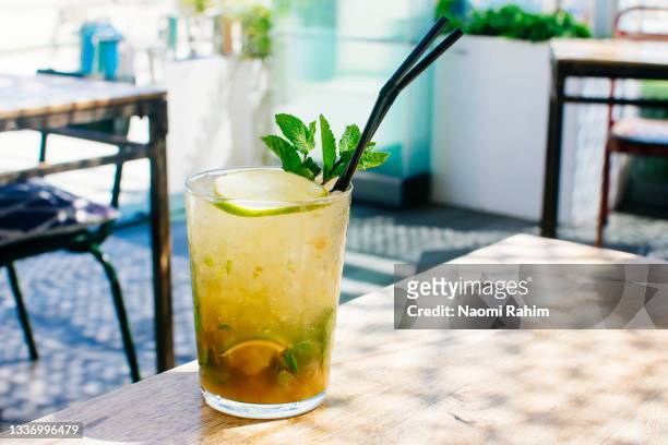mojito cocktail served in a spanish rooftop bar - leaf on roof stock pictures, royalty-free photos & images