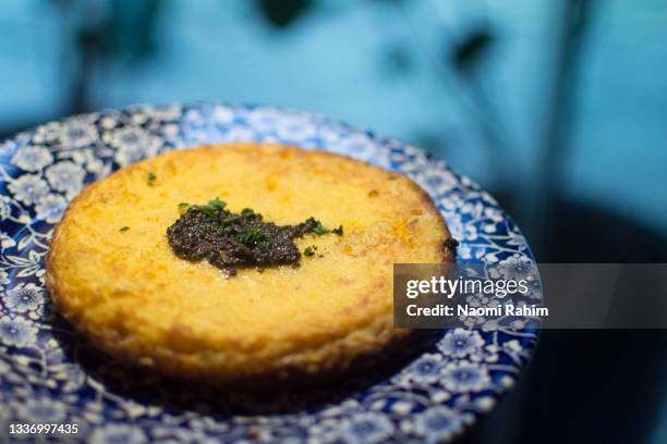 traditional spanish egg potato omelette with garnish, tapas food ready to share - madrid tapas stock pictures, royalty-free photos & images