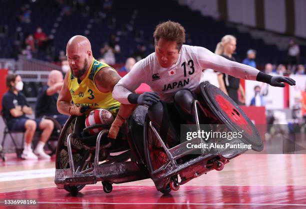 Ryley Batt of Team Australia scores a try as Shinichi Shimakawa of Team Japan defends during the bronze medal wheelchair rugby match on day 5 of the...