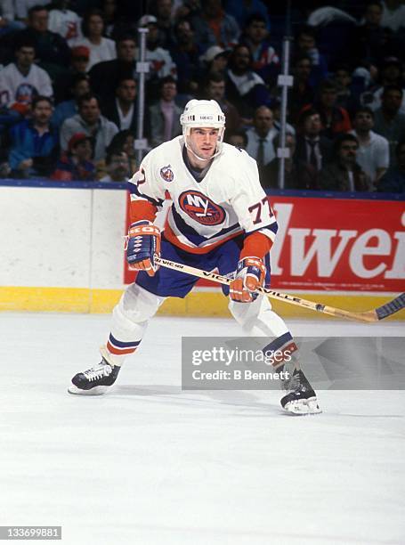 Pierre Turgeon of the New York Islanders skates on the ice during an NHL game in April, 1993 at the Nassau Coliseum in Uniondale, New York.