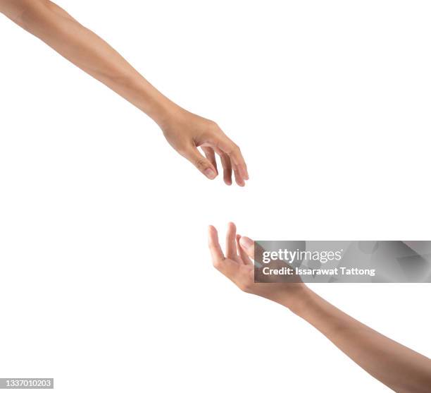 closeup shot of two unrecognisable people reaching for each other with their hands - hand female stock pictures, royalty-free photos & images