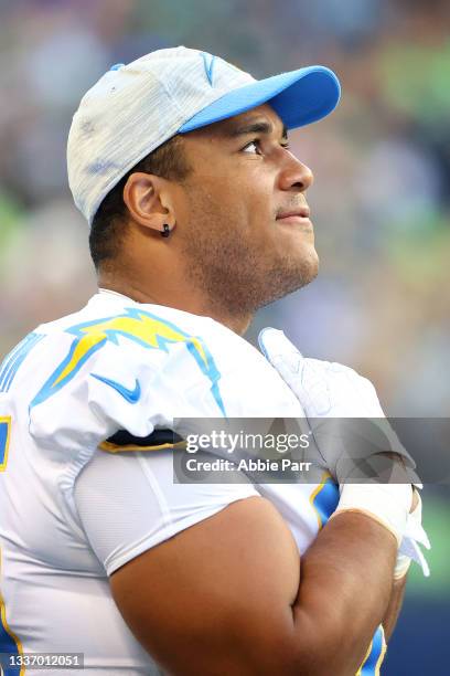 Christian Covington of the Los Angeles Chargers looks on in the first quarter during the NFL preseason game against the Seattle Seahawks at Lumen...