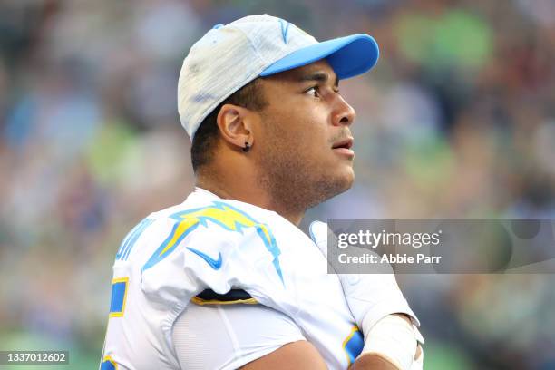 Christian Covington of the Los Angeles Chargers looks on in the first quarter during the NFL preseason game against the Seattle Seahawks at Lumen...