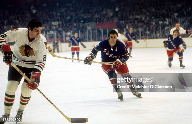 Rod Gilbert of the New York Rangers pressures Jerry Korab of the Chicago Blackhawks circa 1973 at the Chicago Stadium in Chicago, Illinois.