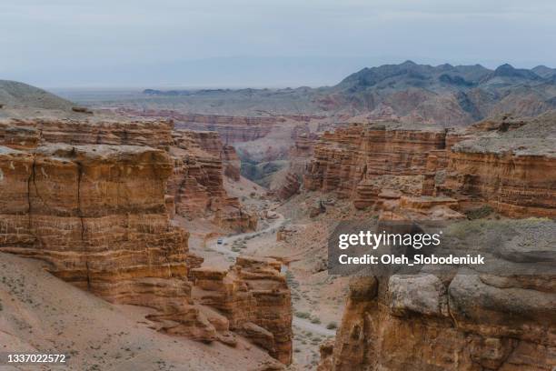 scenic view of canyon in kazakhstan at sunset - kazakhstan stock pictures, royalty-free photos & images