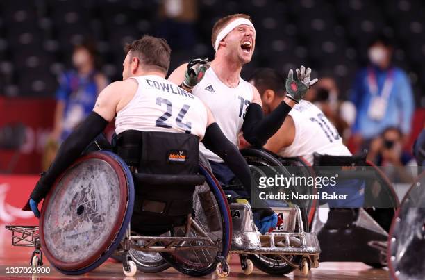 Aaron Phipps of Team Great Britain celebrates with teammates after defeating Team United States during the gold medal wheelchair rugby match on day 5...