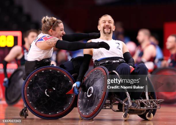 Kylie Grimes and Jonathan Coggan of Team Great Britain celebrate after defeating Team United States during the gold medal wheelchair rugby match on...