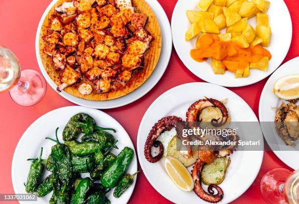 octopus tapas served for lunch at the restaurant, directly above view - patatas bravas bildbanksfoton och bilder