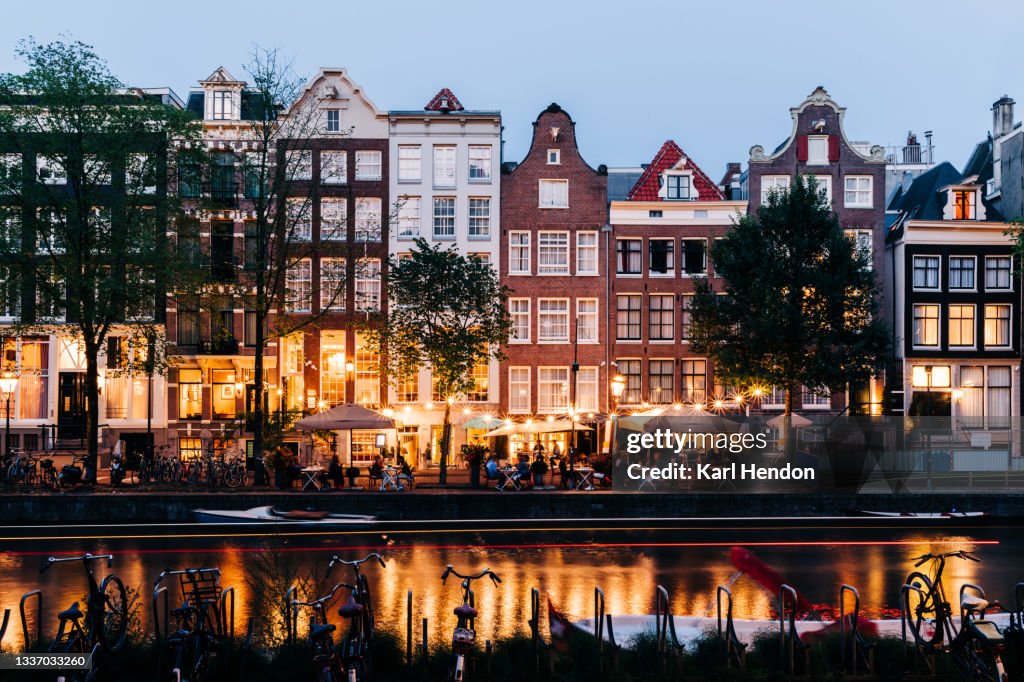 A night-time view of a cafe / street scene in Amsterdam - stock photo