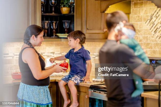 young indigenous family cooking a meal together at home - indian food bildbanksfoton och bilder