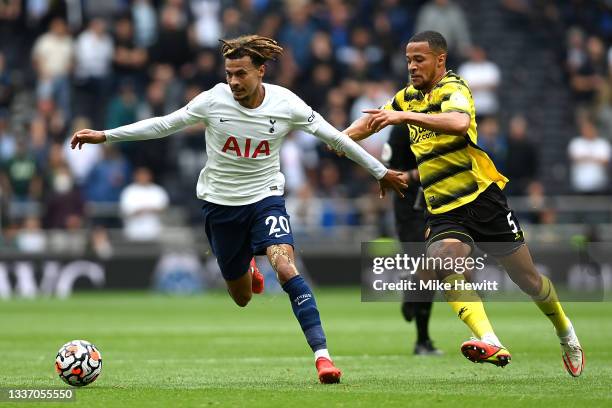 Dele Alli of Tottenham Hotspur battles for possession with William Troost-Ekong of Watford during the Premier League match between Tottenham Hotspur...