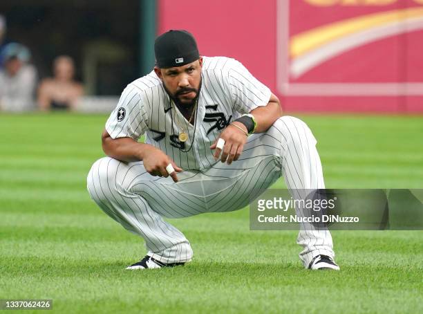 Jose Abreu of the Chicago White Sox warms up prior to a game against the Chicago Cubs at Guaranteed Rate Field on August 27, 2021 in Chicago,...
